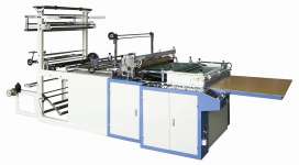 Heat sealing and cutting bag making machine