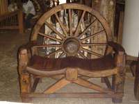 Bench from old wheel of cart