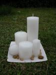 white candle set in plate