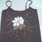 The handicraft nails bead. The handicraft embroiders a flower. Handicraft craft. Handicraft product.