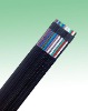 Flat traveling cable with steel supporting